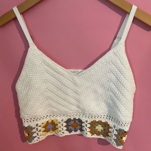small white Hollister top with flowers with adjustable straps